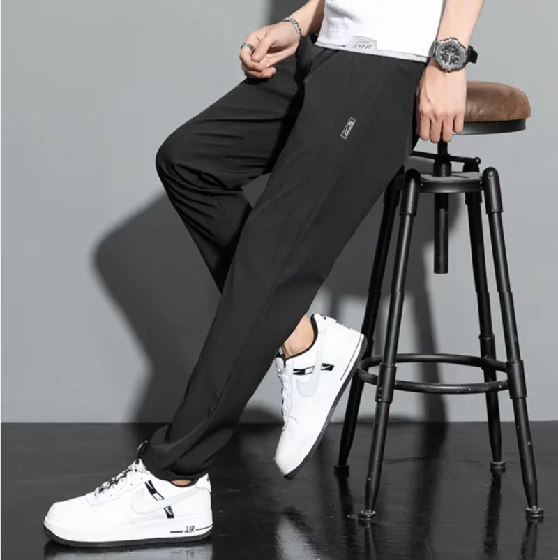 2025 summer new casual men's long pants slim fit and fashionable ice silk straight leg pants men's jogging fast drying sports