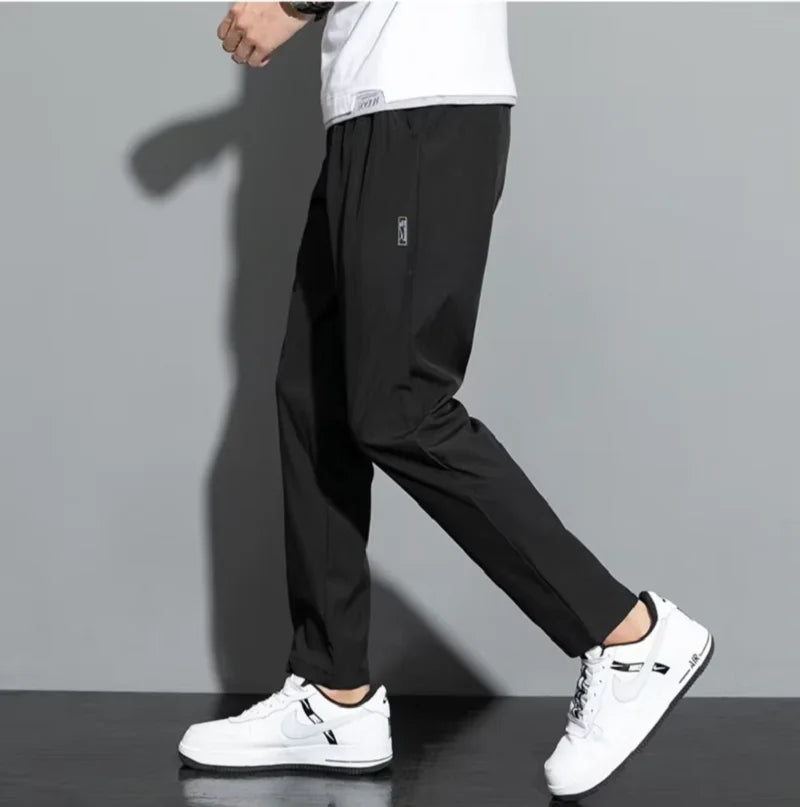 2025 summer new casual men's long pants slim fit and fashionable ice silk straight leg pants men's jogging fast drying sports